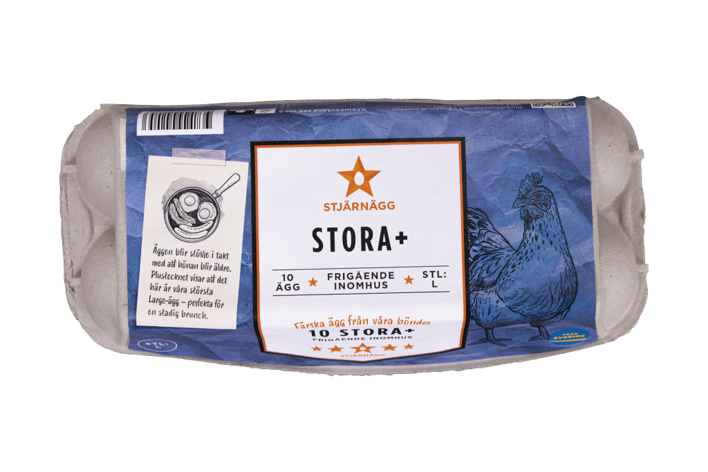 En grå kartong med Stjärnägg STORA+ ägg, märkt med 10 stora ägg från frigående höns inomhus. På förpackningen finns en blå illustration av en kyckling och text på svenska.