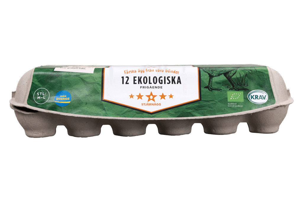 Grå kartong innehållande 12 ekologiska ägg med en grön etikett med texten "12 Ekologiska" och olika certifieringssymboler, bland annat KRAV och EU:s ekologiska logotyp. På etiketten finns också en illustration av en höna.