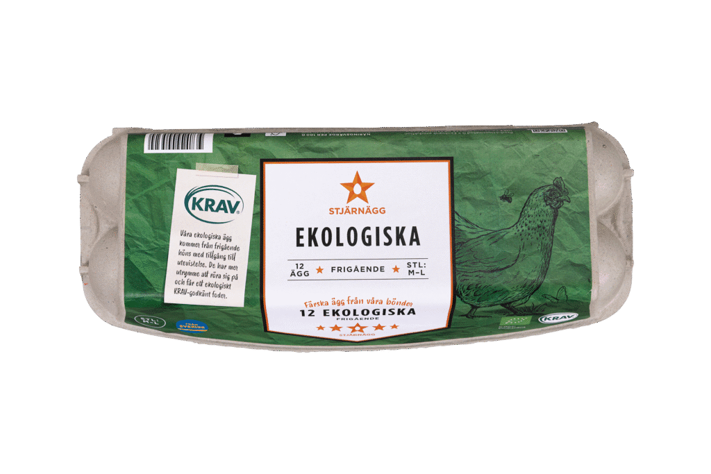 En kartong med ekologiska ägg av märket Stjärnägg märkta Ekologiska med en grön design, en bild av en höna och olika certifieringar inklusive KRAV på förpackningen. Kartongen innehåller 12 ägg från frigående höns.