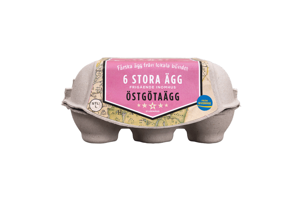 En kartong med sex stora ägg märkta 6 Stora Ägg på svenska med en lila etikett som visar att de är färska och kommer från Östgötaägg, med ett Från Sverige-märke till höger.