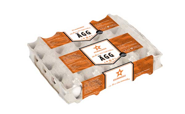En kartong innehållande två dussin ägg, märkt "Stjärnägg Ägg", med orange och vit förpackning och text på svenska.