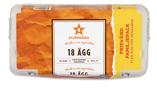 En kartong med 18 ägg från varumärket Stjärnägg, märkt på svenska med gul och orange design. På kartongen står det "Prisvärd familjepack" vilket indikerar en prisvärd familjeförpackning.