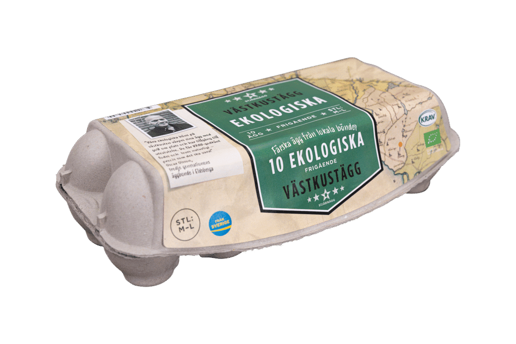 En grå kartong med 10 ekologiska ägg märkta "Ekologiska Västkustägg", med grön och gräddfärgad förpackning och en kartdesign, med miljövänliga och certifieringssymboler på svenska.