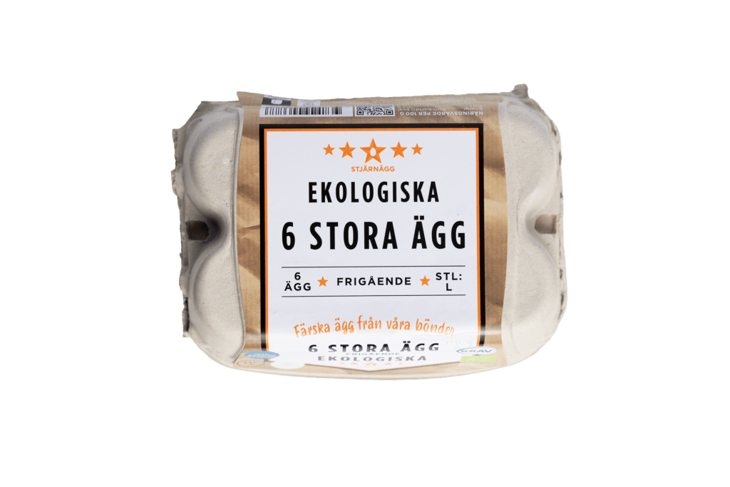 En brun kartong märkt Ekologiska 6 Stora Ägg innehållande sex stora ekologiska ägg, med text på svenska och symboler som indikerar frigående och ekologisk certifiering.
